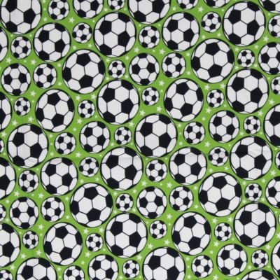Fodbolde og stjerner på grøn fast bomuld